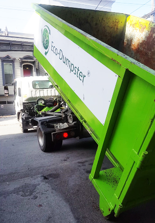 Dumpster Rental Delivery in progress